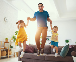 . Happy father's day! Children congratulates dad a jump and dance  .