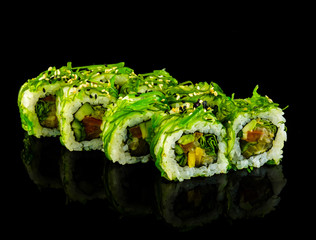 Set sushi roll. Traditional Japanese cuisine. Isolated on black background