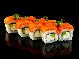 Set sushi roll. Traditional Japanese cuisine. Isolated on black background