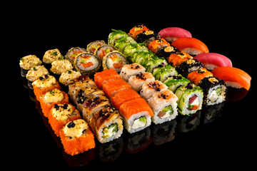 Set sushi roll. Traditional Japanese cuisine. Isolated on black background