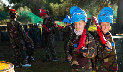 Two kids paintball players