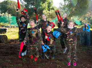 Kids jumping after paintball match