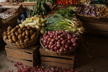 Wicker baskets with vegetables on market