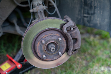 Replacing the brake pads in the car. Repair of the front suspension in the car.