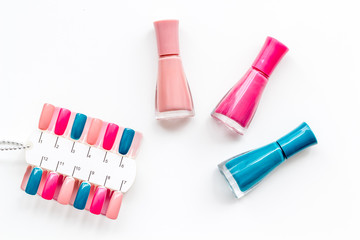 decorative cosmetics set with nail polish and palette for manicure on white background top view