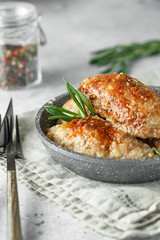 Delicious grilled beef meatballs. Meat patties on the little frying pan served with rosemary