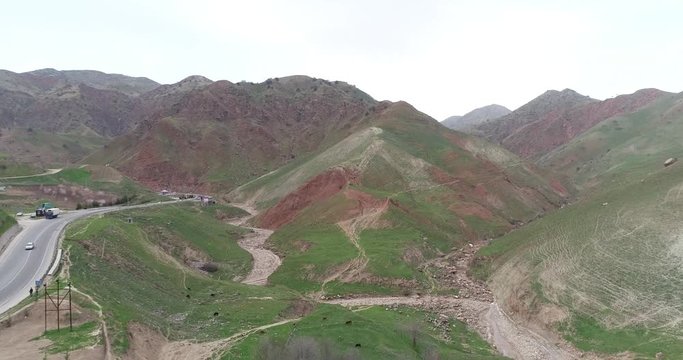 Winding serpentine road in high mountains in Tajikistan.