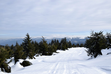 Snow mountain path. Mountain winter track. Winter landscape.