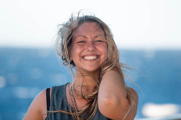 portrait of young woman smiling on a boat 