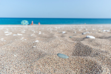 Pebbles lying in sandy beach