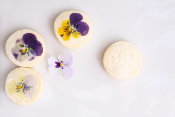 vanilla cookies decorated with edible flowers 