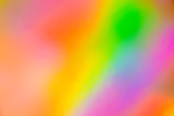 Blurry abstract iridescent holographic foil background.