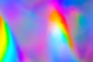 Blurry abstract iridescent holographic foil background.