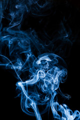 Blue smoke on black background