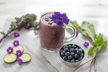 Closeup of purple smoothie made with fresh blueberries and cucumber