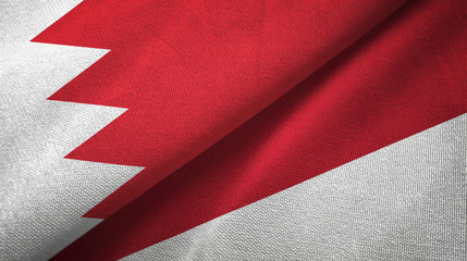 Fototapeta premium Bahrain and Indonesia two flags textile cloth, fabric texture