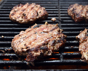 Grilling burgers on a barbecue