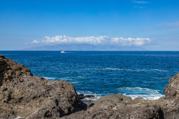 Fototapeta na wymiar View of La Gomera island from Puerto de Santiago