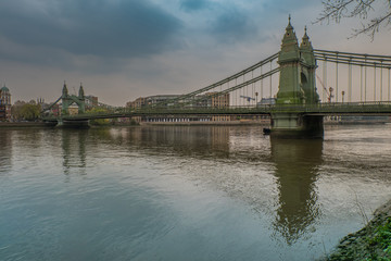 Fototapeta na wymiar Hammersmith Bridge over the river Thames in London, England