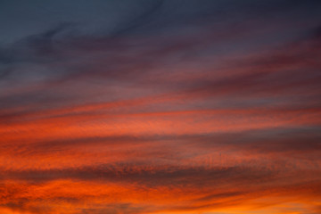 Fototapeta premium Colorful clouds during sunset in full golden hour.