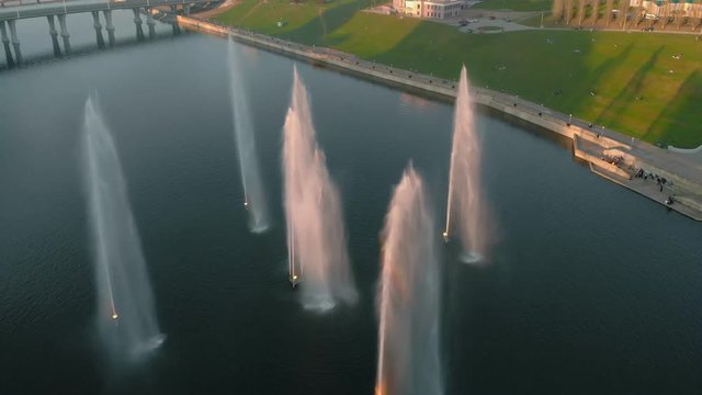 High fountains at sunset. Air shooting from the drone