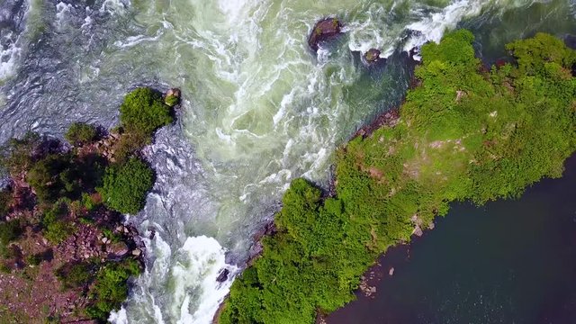 Straight down aerial view of torrents and river currents on the Nile River in Uganda.