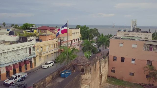 Aerial around the flag of the Dominican Republic in Santo Domingo.
