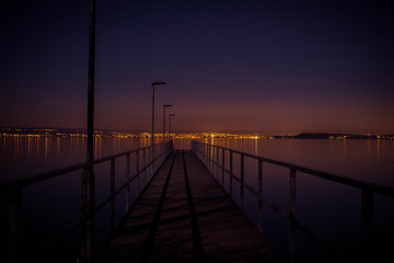 Pier at night city lights