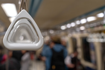Hold on to the handrail in the train.