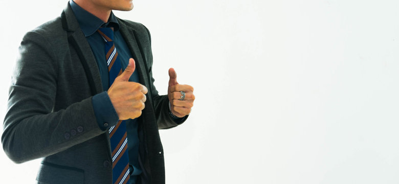 Business man showing thums up on white background. Success and winner concept.