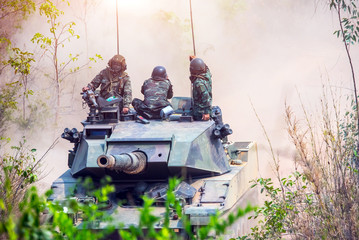 Backside of  Soldier army operation, Grunge style image of modern armored tanks in battle