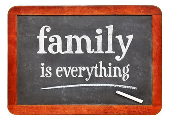 Obraz premium family is everything inspirational text on blackboard