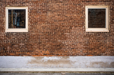 Brick wall with two square windows