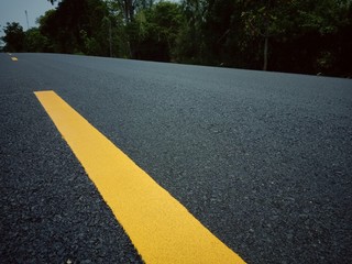 Obraz premium Road traffic paint Yellow on the asphalt surface