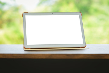 tablet on table isolated screen - Digital tablet compute or laptop blank screen on table nature green background