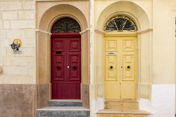 Fototapeta na wymiar twin old wooden door different colour Malta