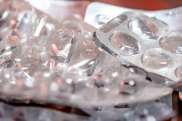 Empty blister packaging of medicine pills on wooden table