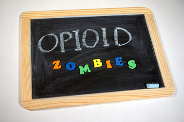 Fototapeta na wymiar Drug problem zombies message on chalkboard