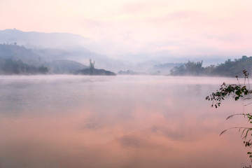 Obraz na płótnie Canvas Tranquil Pa Khong Lake in the morning mist.
