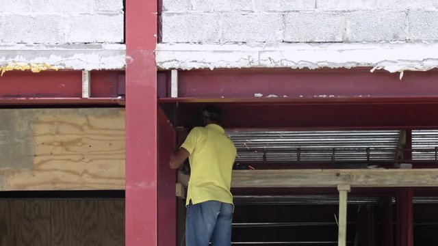 man welding, building building, construction, mason