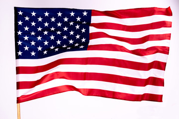 American flag background for Memorial Day or 4th of July with copy space. Or Independence Day background. Beautifully waving star and striped American flag.