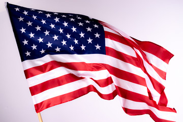 Fototapeta premium American flag background for Memorial Day or 4th of July with copy space. Or Independence Day background. Beautifully waving star and striped American flag.