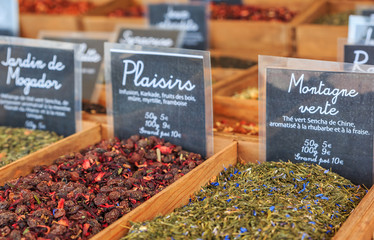 Flavored teas and infusions for sale at a local outdoor farmers market in Nice, France