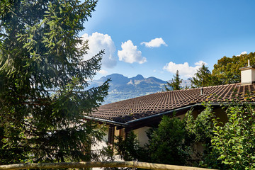 View on roof of traditional house in a small town under beautiful sky