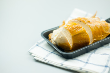Tasty roast chicken serve on black pan