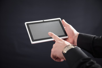 Man using tablet computer. Technology