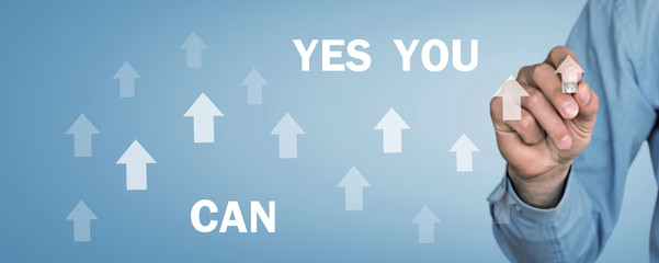 Man holding Yes You Can text with arrows. Motivation, Business, Development