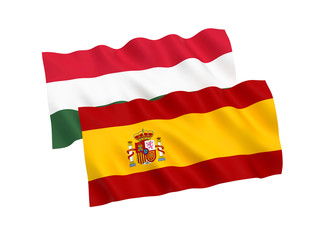 National fabric flags of Hungary and Spain isolated on white background. 3d rendering illustration. 1 to 2 proportion.
