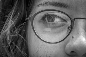 Black and white photo of a young woman's eye