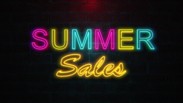 Summer sales text in multicoloured neon lights flickering on brick wall. Summer sales theme concept. 